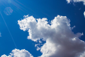 blue sky with fluffy clouds	

