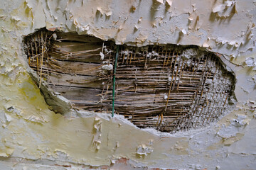 collapsing house with collapsed ceiling, cracks, concept of destruction of buildings from dampness,...