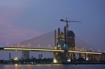 new Rama nine suspension bridge under construction cross Chao Phraya  river in Thailand on night