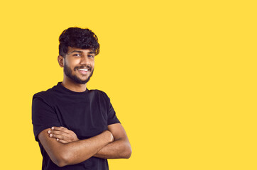 Young ethnic positive Indian man millennial in pose of confident person, looking at camera smiling...