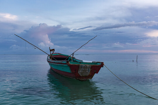 A wooden fishing boat at dawn at Success Beach, Montego Bay, Jamaica 