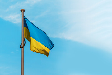 The blue and yellow flag of Ukraine flutters in the wind