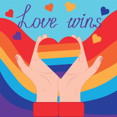 Hands holding a rainbow heart against the background of the LGBT flag