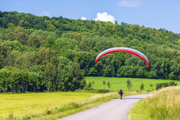 Paraglider on a country road