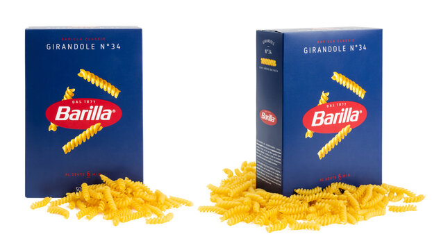 Munich, 05.22.2023: box of Italian Barilla brand "girandole"  spirals pasta surrounded by the actual product / noodles isolated over transparency, two perspectives, cut-out food design element