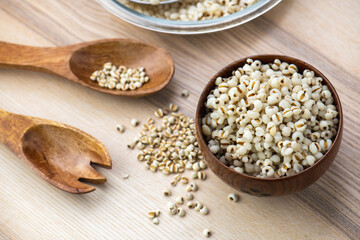 Hot Boiled Job’s Tears millet seed from boiler. White boiled Job’s Tears is highly nutritious cereal healthy fresh organic in salad dish.