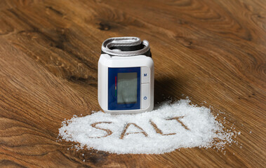 table salt and tonometer as a symbol of bad effects on health.