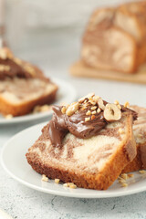 	
A piece of marble biscuit with chocolate cream and nuts