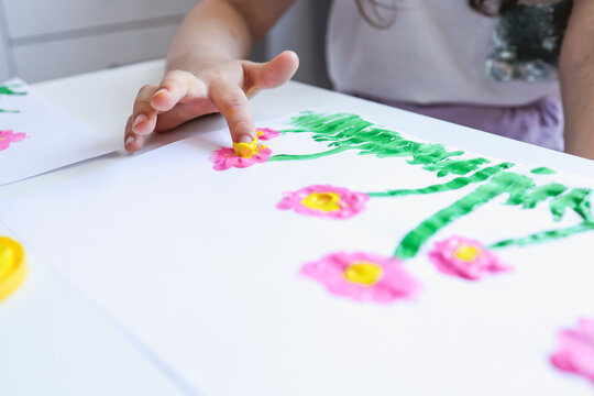 Finger painting. Close-up. Fingers of children's hands in bright paint. Early development. Hobby