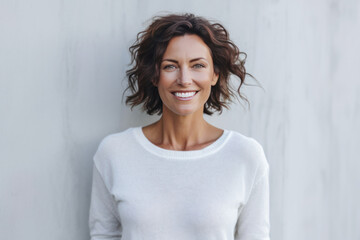 Smiling brunette woman in a white top. Generative AI.