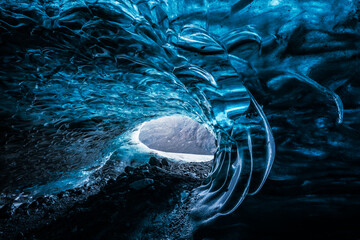 Ice Cave in Vatnajokull Glacier in Iceland - amazing colors create an unearthly atmosphere.