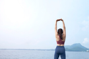 The asian woman do yoga in holiday time, on modern concept and healthy. Nature  background with exercise and nature, female happiness concept