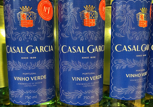 Viersen, Germany - May 9. 2023: Closeup of bottles Casal Garcia portuguese vinho verde wine in shelf of german supermarket