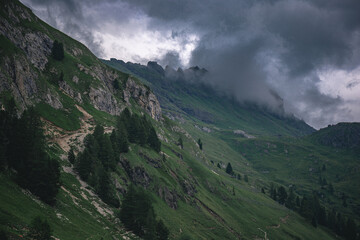 Naklejka na ściany i meble clouds over the mountains