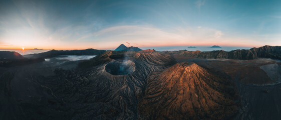 Aerial drone view of Bromo crater Mountain, East Java, Indonesia. man standing on the edge of Bromo...