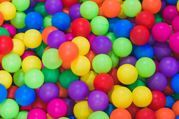 Fototapeta na wymiar Colorful balls to play / Inside the beautiful children's playground color plastic ball of the game room