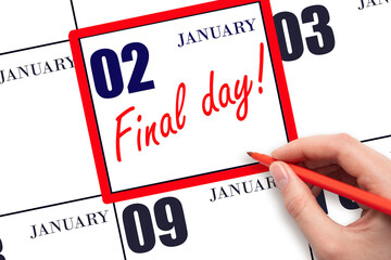 Hand writing text FINAL DAY on calendar date January 2.  A reminder of the last day. Deadline....