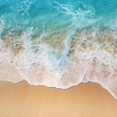 Fototapeta na wymiar Top view of sandy beach and soft blue ocean wave