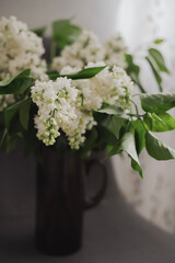 Fresh fragrant lilac flowers in the home interior
