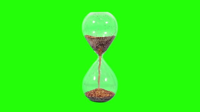 Golden hourglass on the light green screen