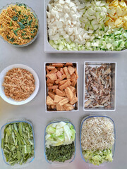 Top view Gudangan. Javanese traditional menu made from vegetables, grated coconut sambal, fried...