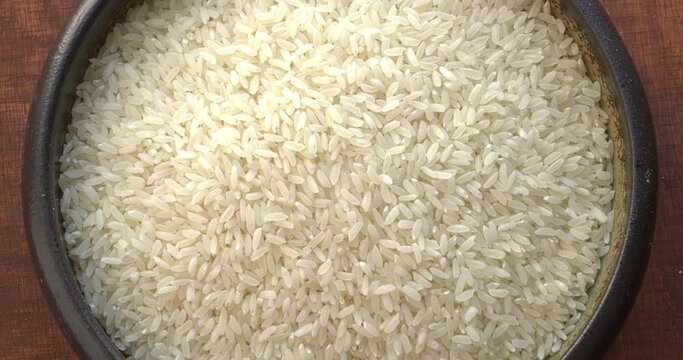 Sona masoori rice in bowl. Light and aromatic medium grain rice, which was created as a result of crossing Sona and Mahsuri rice varieties.