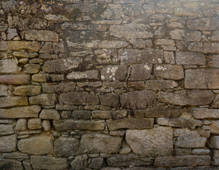 Old stone wall ideal for backgrounds and textures