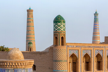 The Kutlimurodinok Madrasah and Islam Hoja Minaret in the fortress Ichon-Qala, the old town of Khiva (Xiva), Uzbekistan.