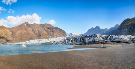 Breathtaking view of Skaftafellsjokull glacier tongue and volcanic mountains around on South...