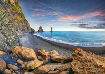 Breathtaking view of rock formations Troll Toes on Black beach Reynisfjara near the village of Vik.