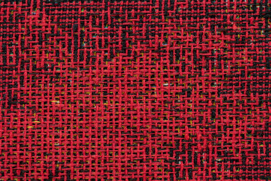 Detalle de los hilos de colores entrelazados que forma un tejido