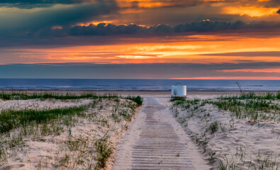 Wooden footpath leading to the shore of the Baltic Sea