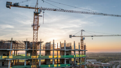 A construction site with yellow tower crane