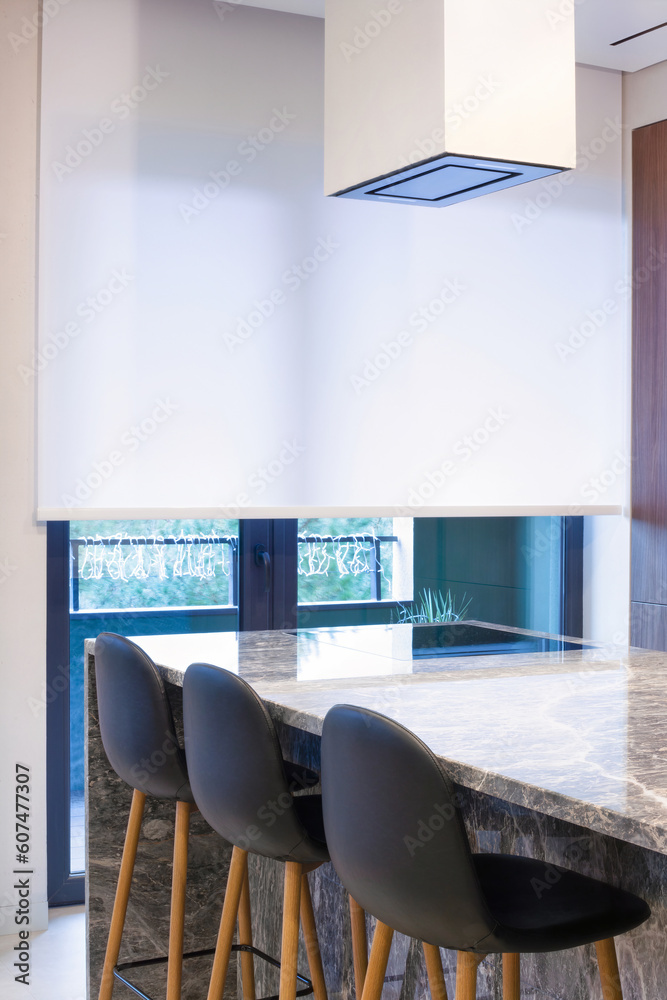 Poster roller blind large size on the window in the interior. motorized roller shade white color in the kit