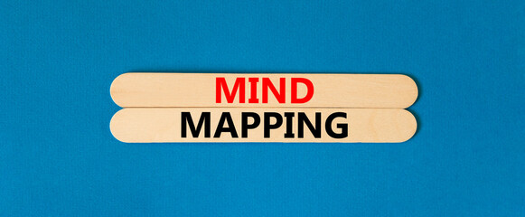 Mind mapping symbol. Concept words Mind mapping on beautiful wooden stick on a beautiful blue table blue background. Business, support, motivation, psychological and mind mapping concept. Copy space.