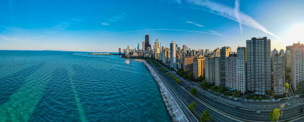 panoramic aerial drone view of Chicago metropolis from the lake during high noon.  the beautiful skyscraper showcases of the wonders of the city architecture. related to business finance and travel 