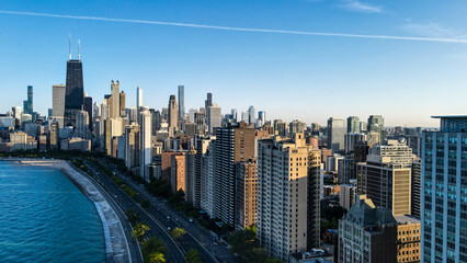 aerial drone view of Chicago metropolis from the lake during high noon.  the beautiful skyscraper showcases of the wonders of the city architecture. related to business finance and travel 