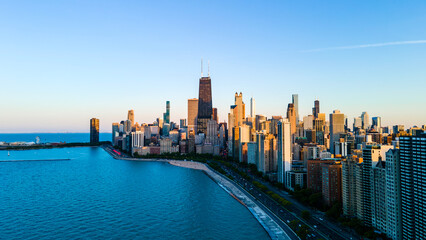 Fototapeta na wymiar aerial drone view of Chicago metropolis from the lake during high noon. the beautiful skyscraper showcases of the wonders of the city architecture. related to business finance and travel 