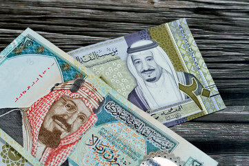 20 SAR twenty Saudi Arabia Riyals banknotes currency bill money an old one with king AbdulAziz photo, Quba Mosque, light mountain and new one with King Salman photo, G20 summit logo and world map