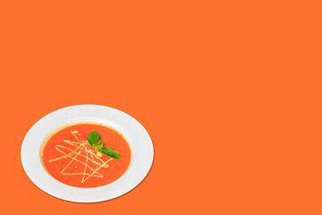 Creamy Tomato soup in a bowl on background. copy space.