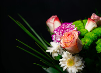 Bouquet of flowers on a black background. Photo for card on Valentine's, women's, mother's, birthday, father's day, grandmother's day, grandfather's day, boyfriend's day. Background banner for website