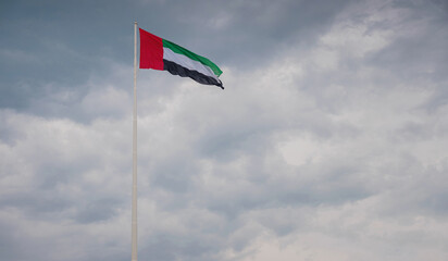 United Arab Emirates flag flying against sky. UAE celebrates it's national day on 2nd December every year. Emirates Heritage Club Heritage Village
