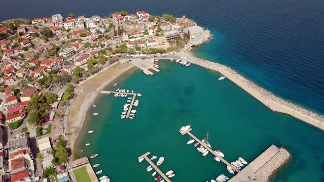 4k drone flying over footage (Ultra High Definition) of Astros port. Beautiful morning seascape of Myrtoan Sea. Adorable outdoor scene of Peloponnese peninsula, Greece, Europe.
