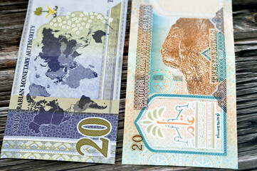 20 SAR twenty Saudi Arabia Riyals banknotes currency bill money an old one with king AbdulAziz...