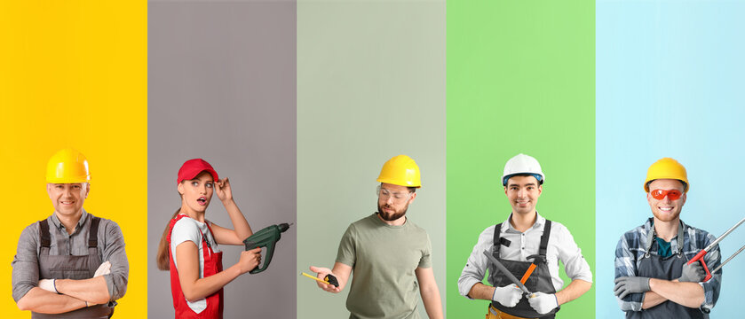 Group of carpenters on color background