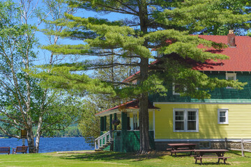 Naklejka premium Inlet, New York: One of the Arrowhead Park Cottages on Fourth Lake in the Adirondack Park, formerly part of the historic Arrowhead Hotel.