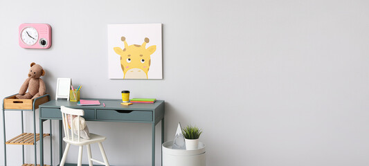 Child's room with table and chair near light wall. Banner for design