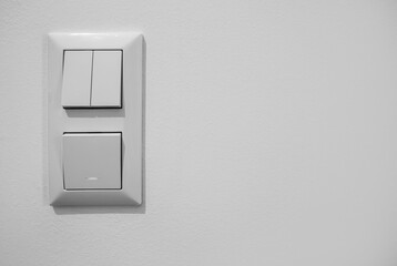 Modern switches on light wall