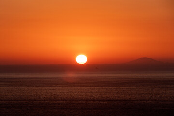 Sunset from the purple coast of Calabria, in the background the Aeolian Islands.
