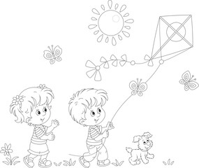 Happy little girl and boy with their merry pup playing with a flying colorful kite on a sunny summer day in a park, black and white vector cartoon illustration for a coloring book
